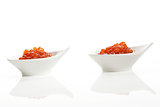 Two bowls with red caviar.