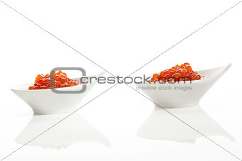 Two bowls with red caviar.
