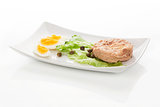 Tuna with salad, eggs and capers.