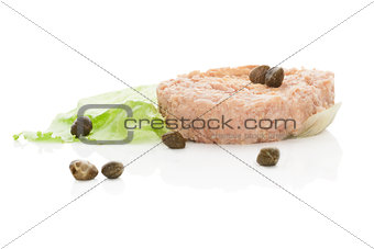 Tuna steak with lettuce salad isolated on white.