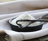 vanilla sugar with natural stick in a wooden bowl