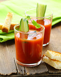 tomato soup gazpacho with crackers and cucumber