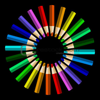 Color pencils in arrange in color wheel colors on black backgrou