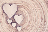 valentine's wooden hearts on a wooden background in retro color