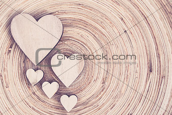 valentine's wooden hearts on a wooden background in retro color