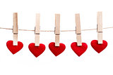 Red fabric heart hanging on the clothesline