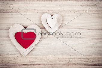 valentine's wooden hearts on a wooden background