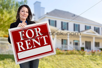 Hispanic Female Holding For Rent Sign In Front of House