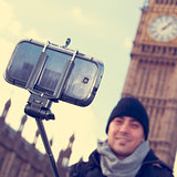 man taking a selfie in front of the Big Ben in London, United Ki