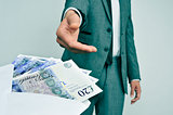 man taking an envelope full of pound sterling bills