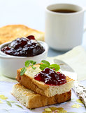 breakfast with fresh toast and cherry jam