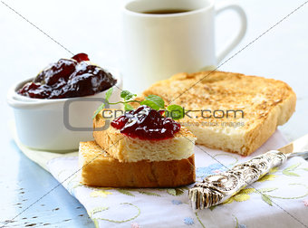 breakfast with fresh toast and cherry jam