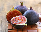 natural purple ripe figs on a wooden table