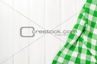 Green towel over wooden kitchen table