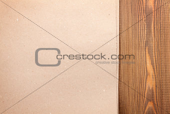 Cardboard paper over wooden background