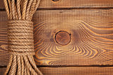 Wooden background with marine rope