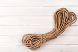 Wooden background with marine rope