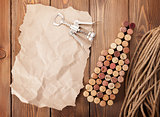 Wine bottle shaped corks, corkscrew and piece of paper for copy 