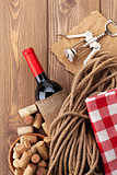 Red wine bottle, corks and corkscrew