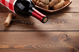 Red wine bottle, corks and corkscrew