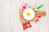 Healthy breakfast with fried egg and tomatoes