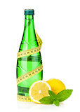 Water bottle, measuring tape, lemon and mint