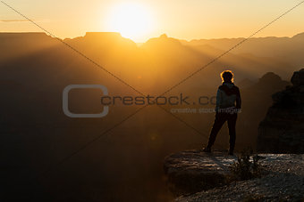 Girl watching sunset at Grand Canyon