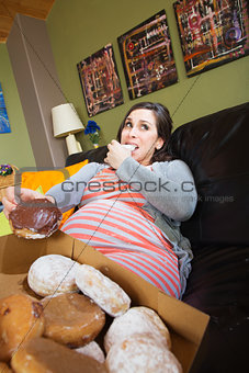 Pregnant Woman Eating Donuts