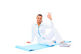 fitness woman making a break in tailor-seat on white background