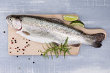 Freh trout on kitchen board.