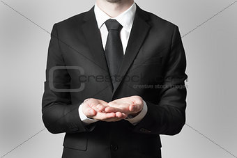 businessman begging gesture black suit