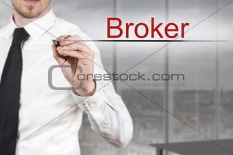businessman writing broker in the air