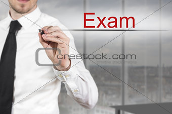 businessman writing exam