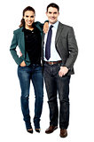 Full length of business couple posing