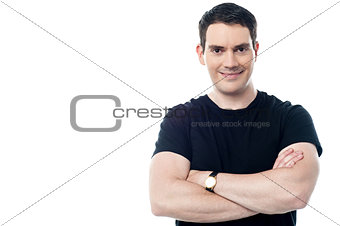 Smiling man with folded arms