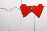 Two red hearts tied together. Valentine Day.