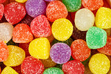 Assorted multicolored gum drops.