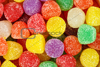 Assorted multicolored gum drops.