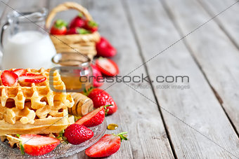 Waffles with strawberry abd honey background