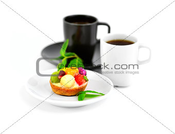 Small fruit cake and two cups of coffee
