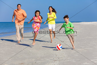 Family Playing Football Soccer on Beach