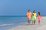 Mother Father and Children Family Walking On Beach