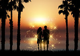 Couple holding hands against a sunset background