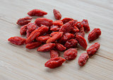 Heap of Dry Goji Berries on the Wooden Table