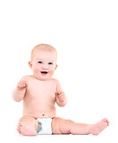 Baby is sitting on floor, isolated on white