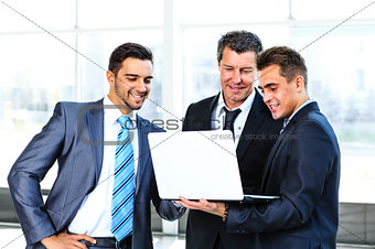 group of business people doing presetation with laptop