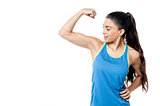 Sporty woman flexing her biceps