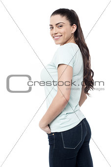 Woman looking back over white