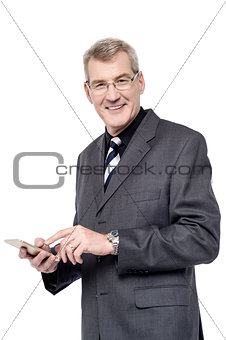 Senior businessman using a cell phone