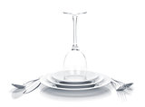 Silverware or flatware set and wine glass over plates